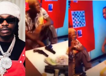 Naira Marley and Mohbad spotted with guns, sm0king together in a throwback video, netizens react (VIDEO)